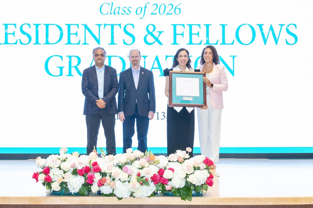 Dr. D. Congratulating Student
